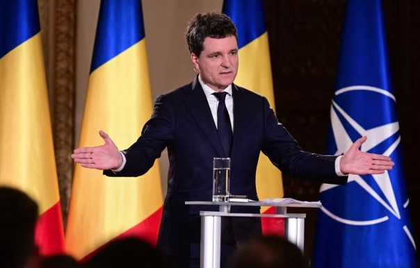 New Romanian head commits to firm NATO rise despite deficit crisis