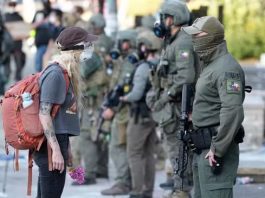 Hundreds protest outside ICE building in Portland after Trump orders troop deployment