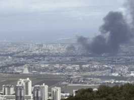 Firefighters battle blaze at the Bazan refinery in Haifa following missile barrage