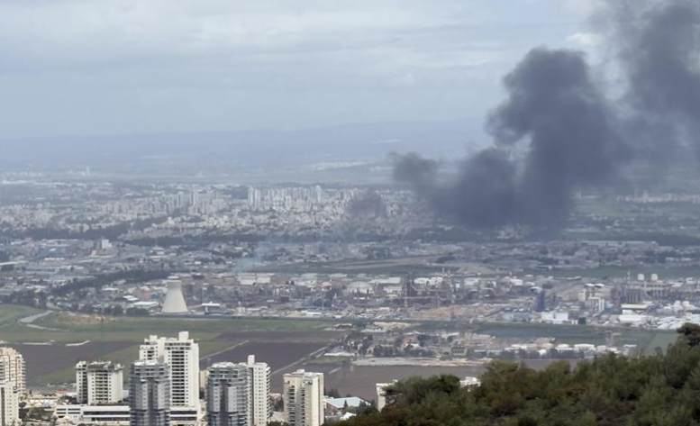 Firefighters battle blaze at the Bazan refinery in Haifa following missile barrage